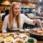 how to eat korean bbq table full of banchan and grilling pork belly Seoul restaurant