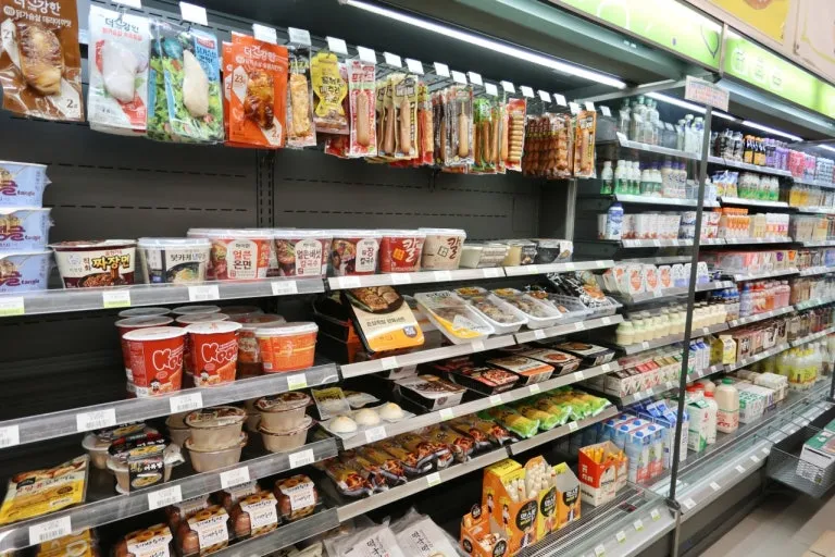 Korean convenience store food including ramen and ready-to-eat meals